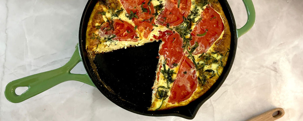 breakfast frittata in green enameled cast iron skillet