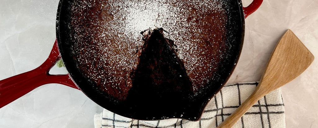 Brownie slice cut from brownie in larder and vine cast iron skillet